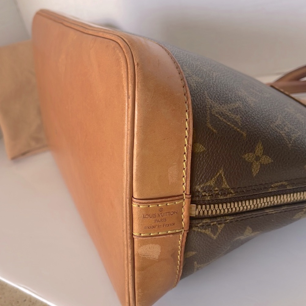 Authentic LOUIS VUITTON Alma Monogram Handbag - Picture 8 of 17